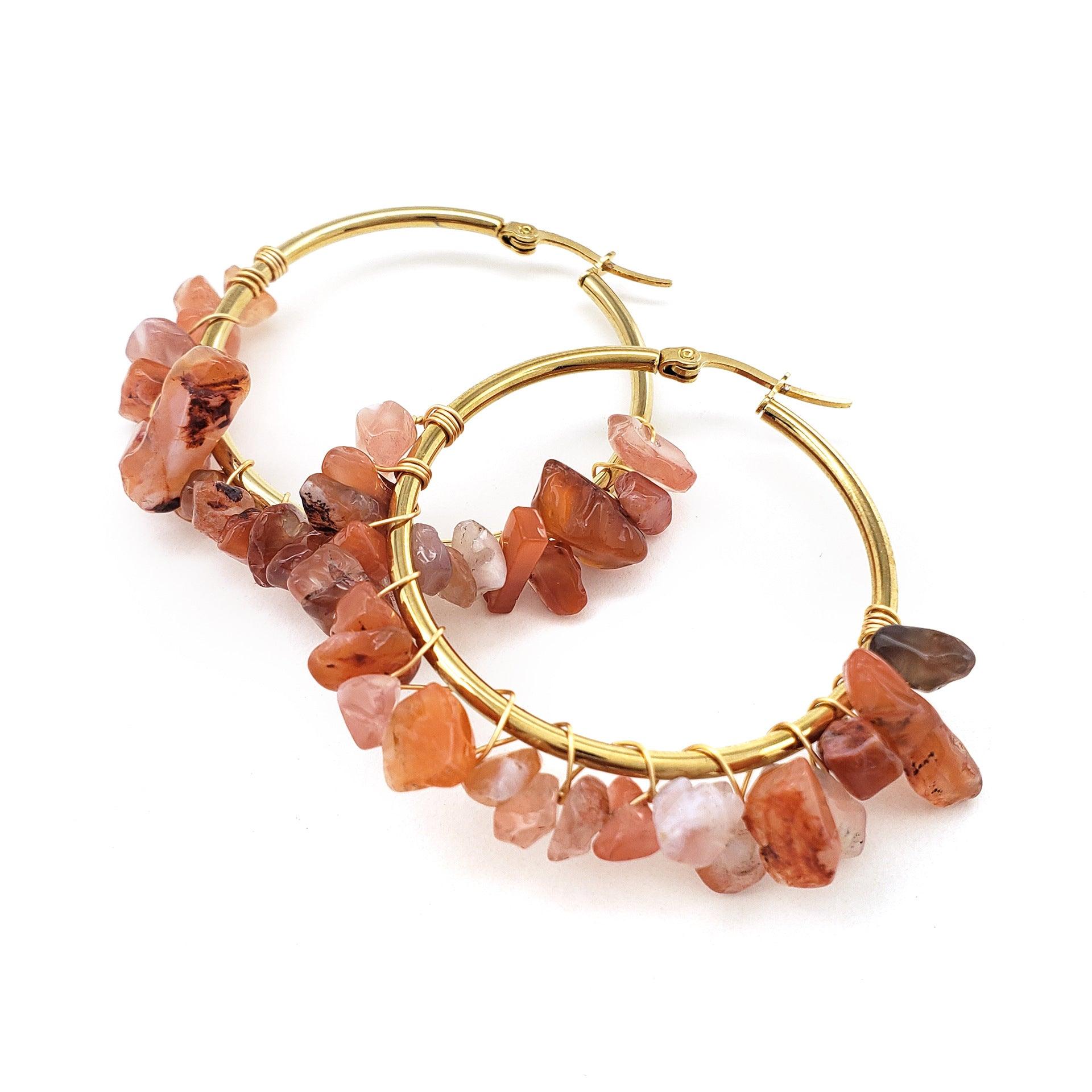 Adorned with vibrant orange stones, these earrings radiate warmth and energy. Orange stones are commonly associated with confidence and creativity, making them suitable for individuals who wish to express passion and individuality